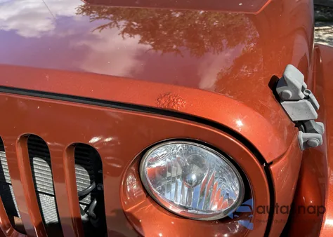 2014 Jeep Wrangler Sahara z USA, uszkodzony, nr VIN 1C4AJWBG7EL195101